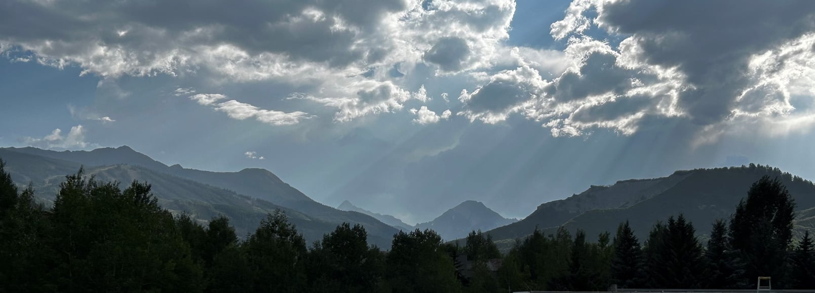 Image of mountains around Snowmass Village, including Mount Daly in the distance.